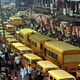 Pedestrians push their way through a traffic jam in downtown Lagos in 1999.